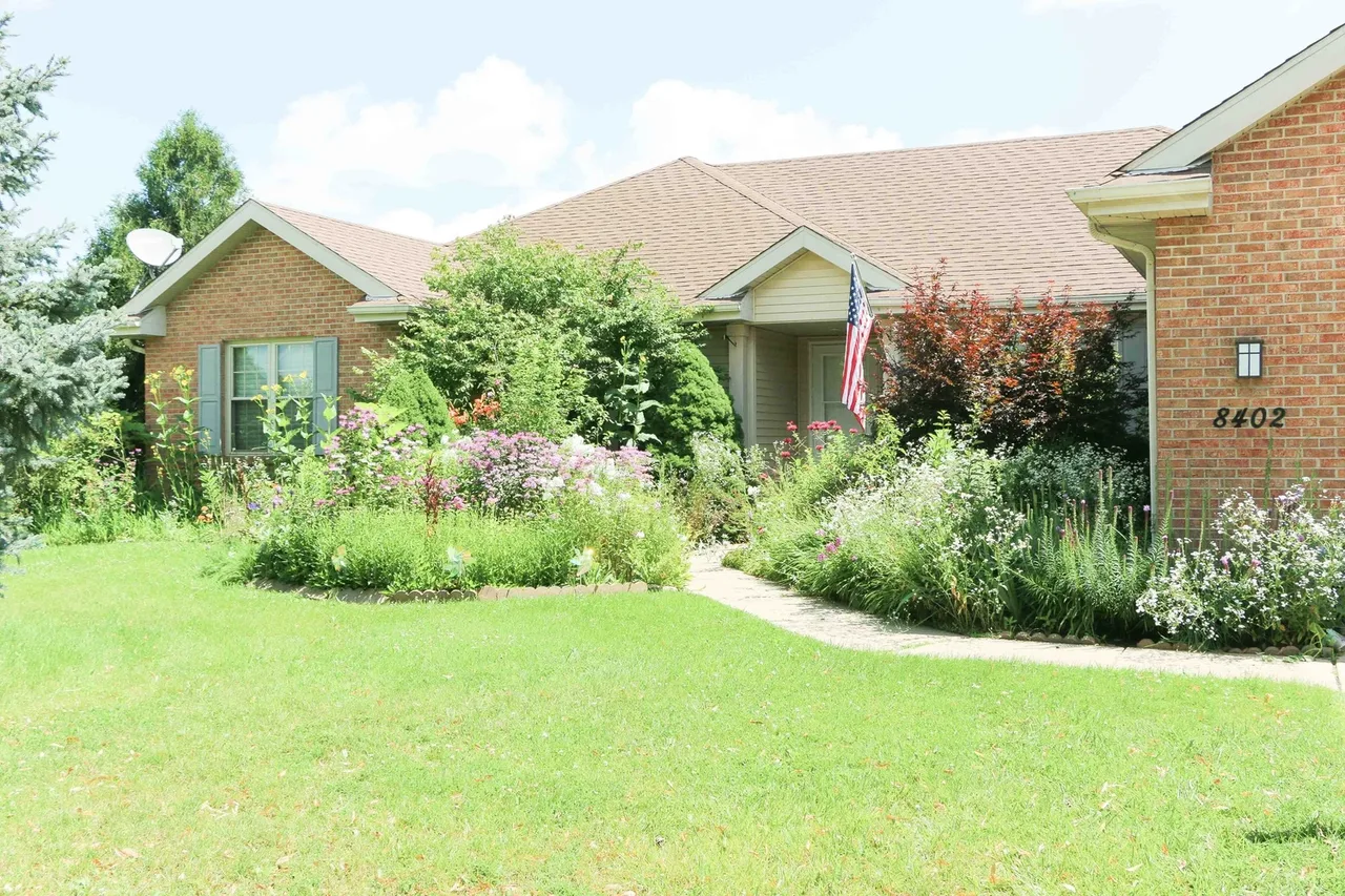 Castle Pines site exterior with a landscaped front yard at BBDS Castle Pines, Madison, WI