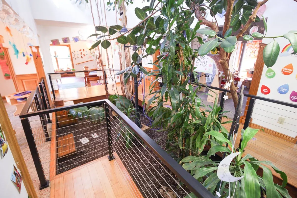 Kempfer Lane classroom with indoor plants and low play tables at BBDS Kempfer Lane, Verona, WI