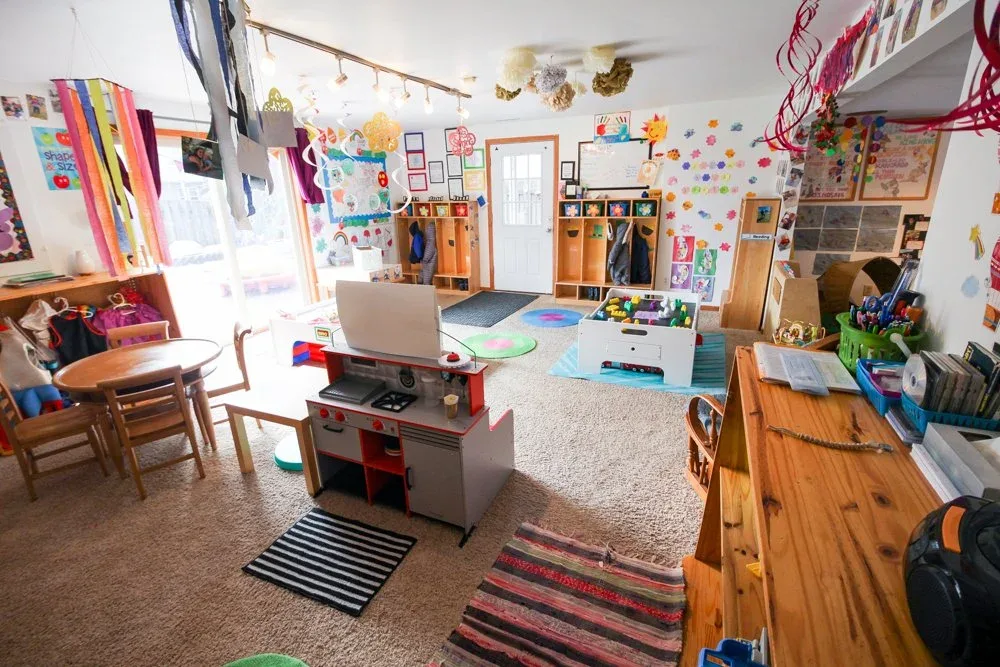 Morraine View classroom with an activity table beneath hanging decorations at BBDS Morraine View, Madison, WI