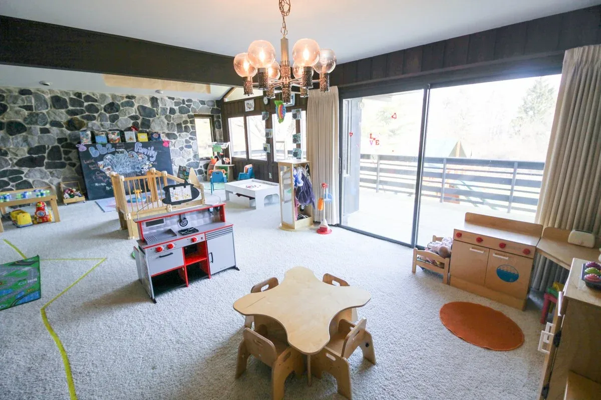 Applewood classroom with a round wooden table and large windows at BBDS Applewood Drive, Madison, WI