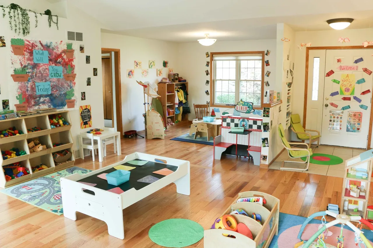 Castle Pines classroom with toy shelves and a low activity table at BBDS Castle Pines, Madison, WI