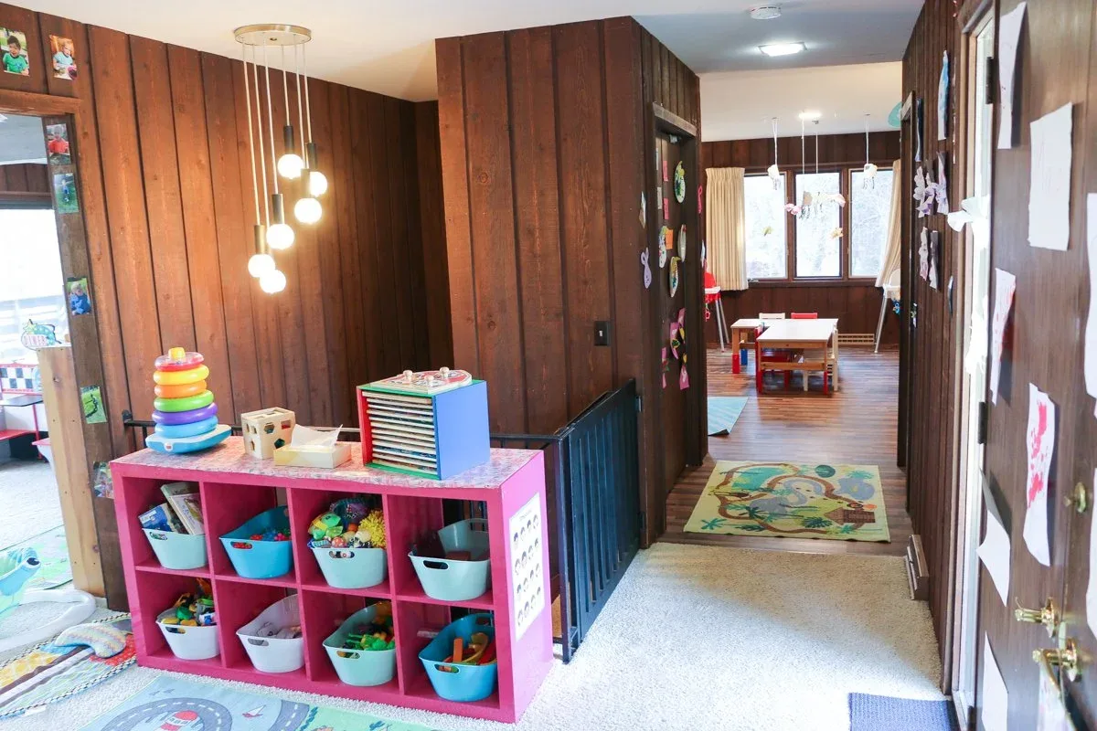 Applewood room with colorful toy cubbies and wood-paneled walls at BBDS Applewood Drive, Madison, WI