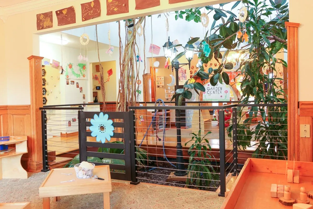 Kempfer Lane classroom with a wooden room divider and leafy decorations at BBDS Kempfer Lane, Verona, WI