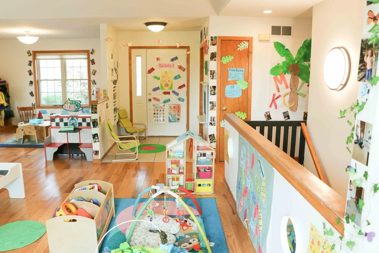 Castle Pines classroom with activity spaces, low tables, and wall displays at BBDS Castle Pines, Madison, WI