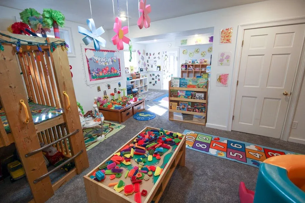 Activity tables and toys under paper decorations