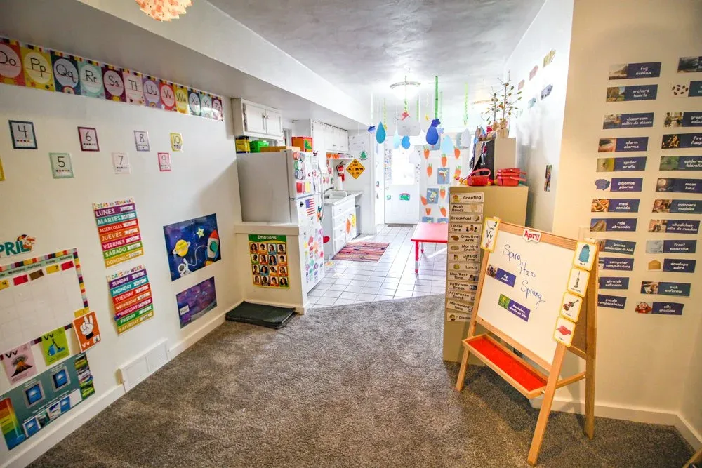 Classroom kitchen area with learning materials and an activity board