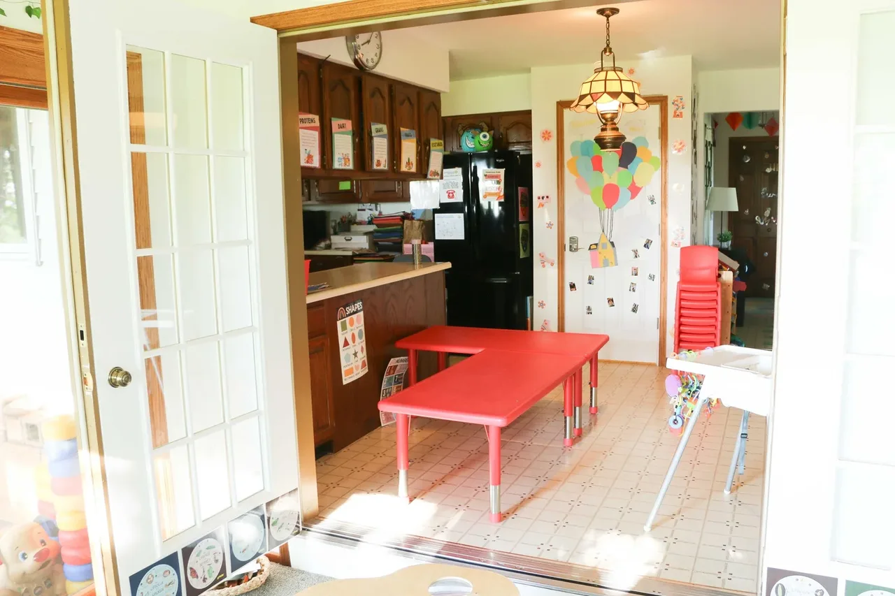 Valley Woods room with a red activity table and storage shelves at BBDS Valley Woods, Verona, WI