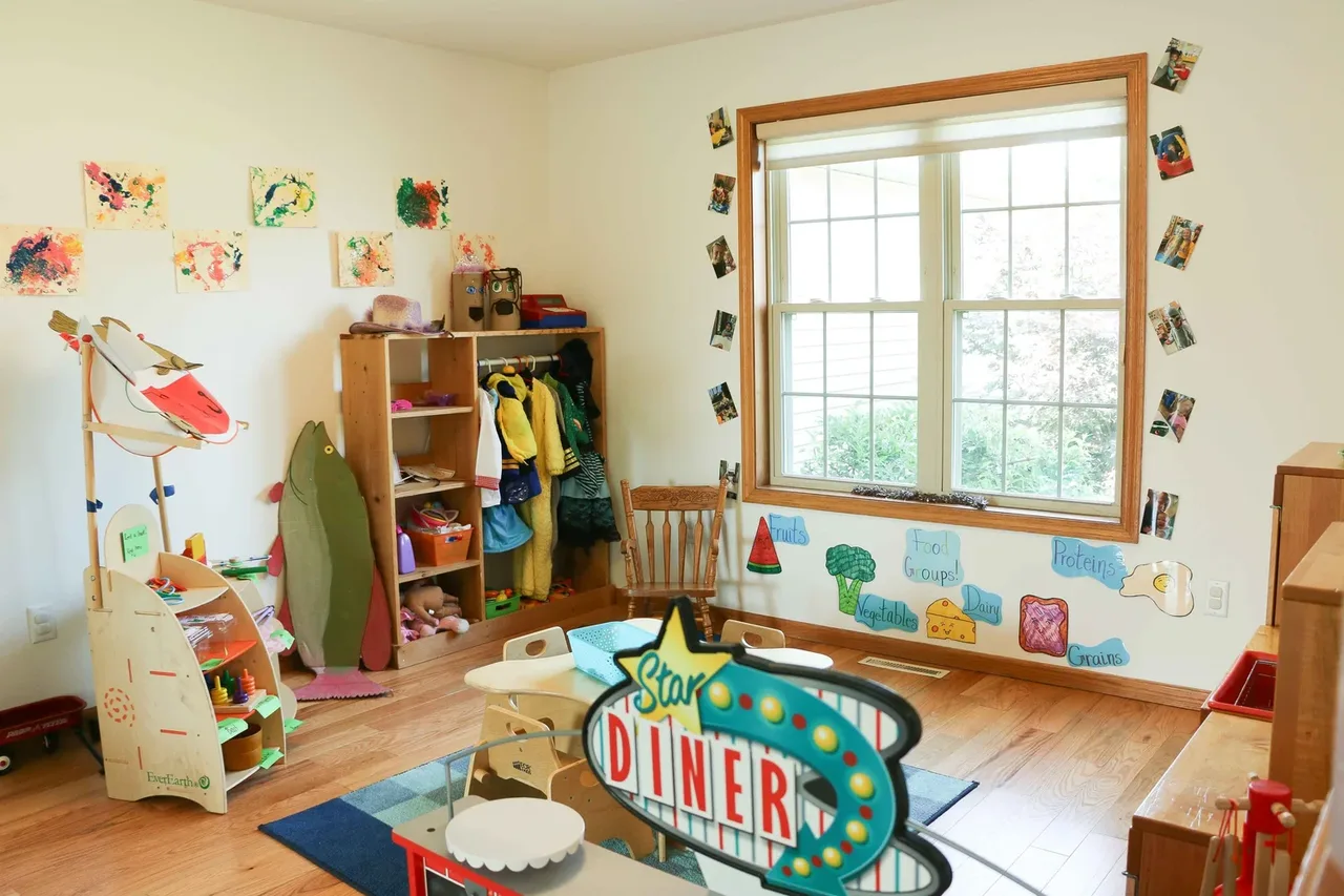 Castle Pines pretend-play corner with toy kitchen furniture at BBDS Castle Pines, Madison, WI