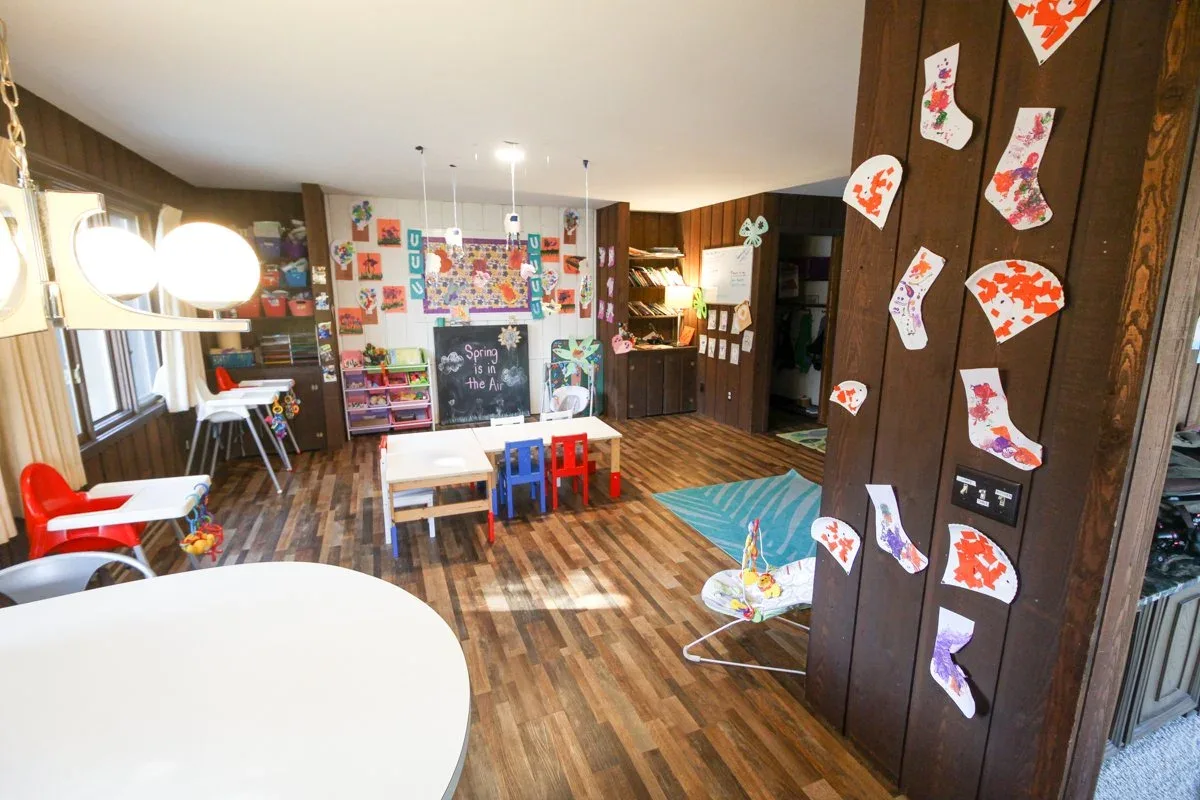 Applewood classroom with wood flooring, an activity table, and toys at BBDS Applewood Drive, Madison, WI