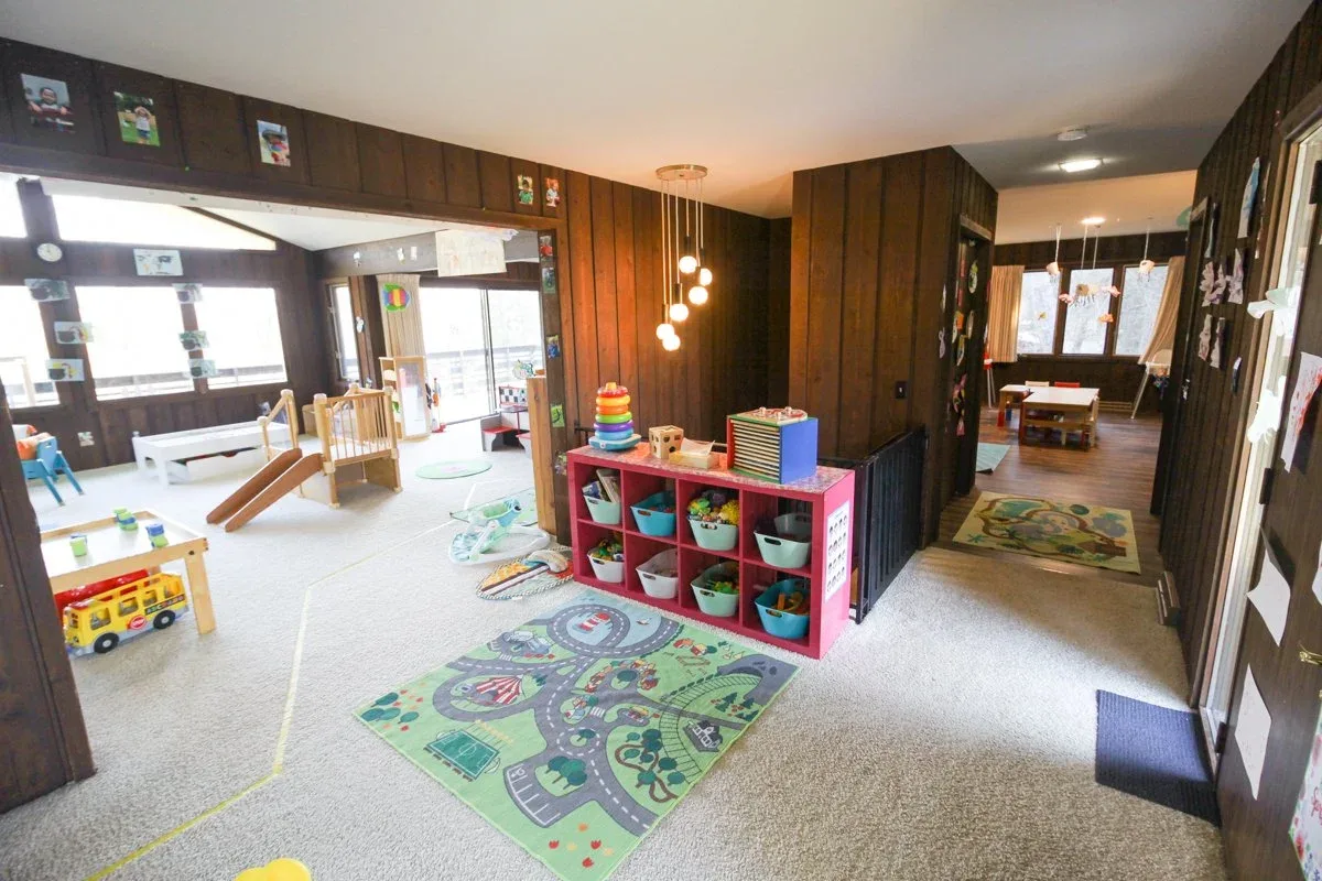 Applewood classroom with toy cubbies and a colorful floor rug at BBDS Applewood Drive, Madison, WI
