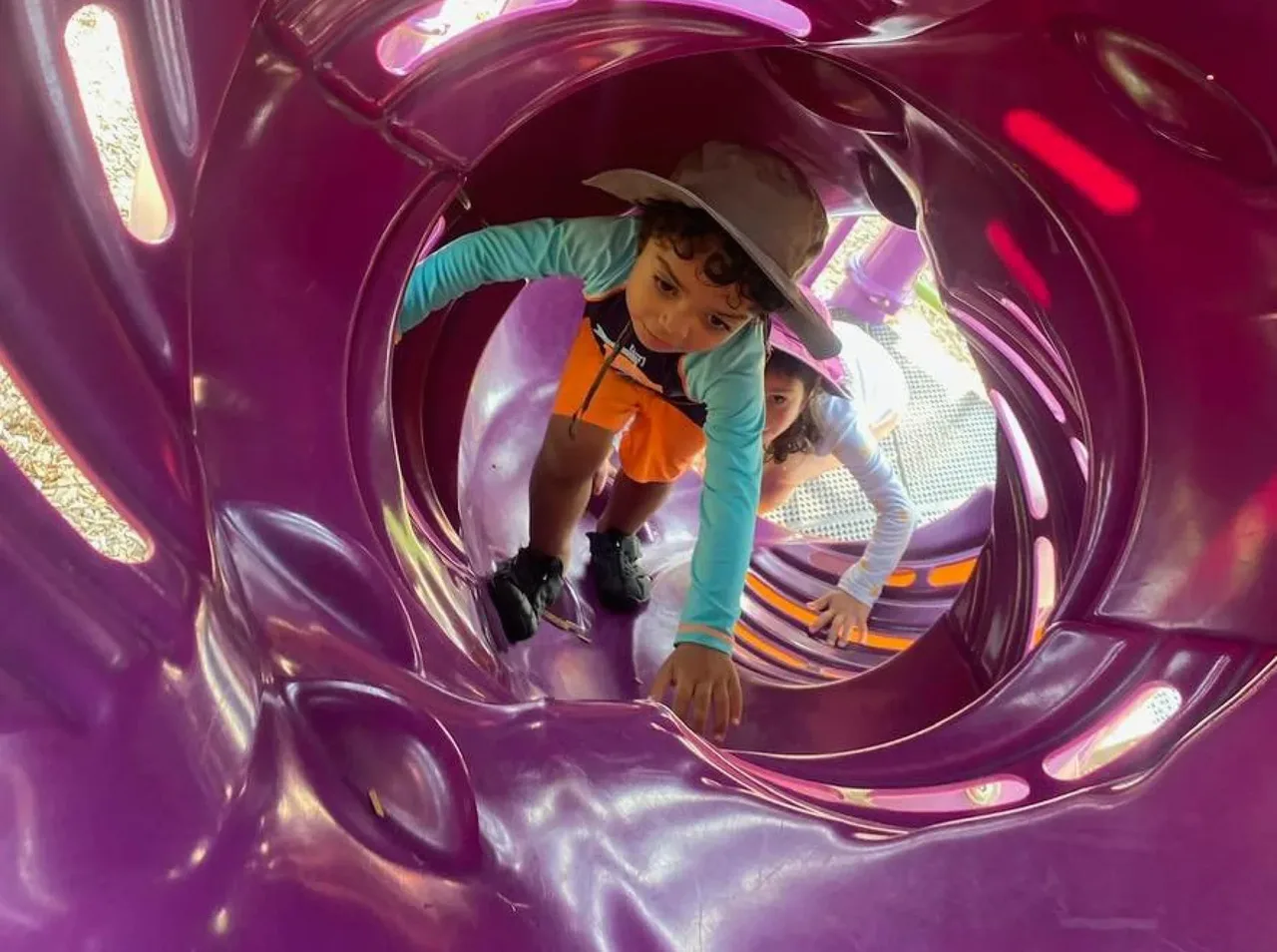 Child exploring a sensory play tub