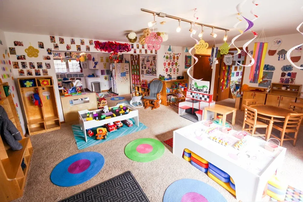 Morraine View classroom with a round activity table and colorful rugs at BBDS Morraine View, Madison, WI