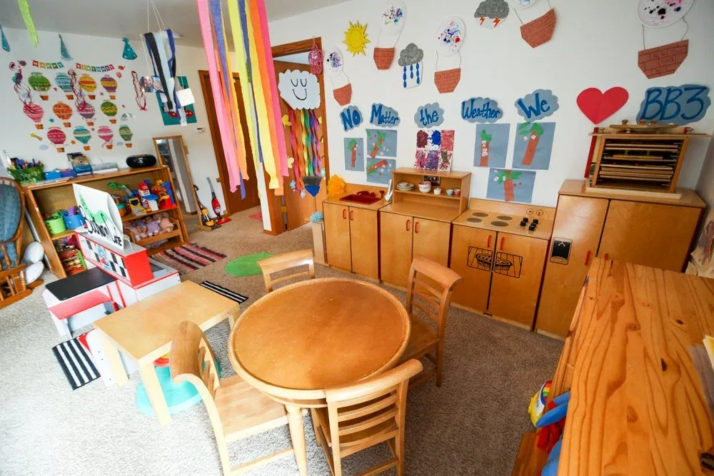 Morraine View room with a round wooden table and wall displays at BBDS Morraine View, Madison, WI